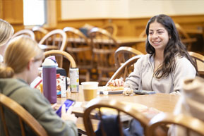 Students relax and chat during lunch. Links to Gifts of Life Insurance
